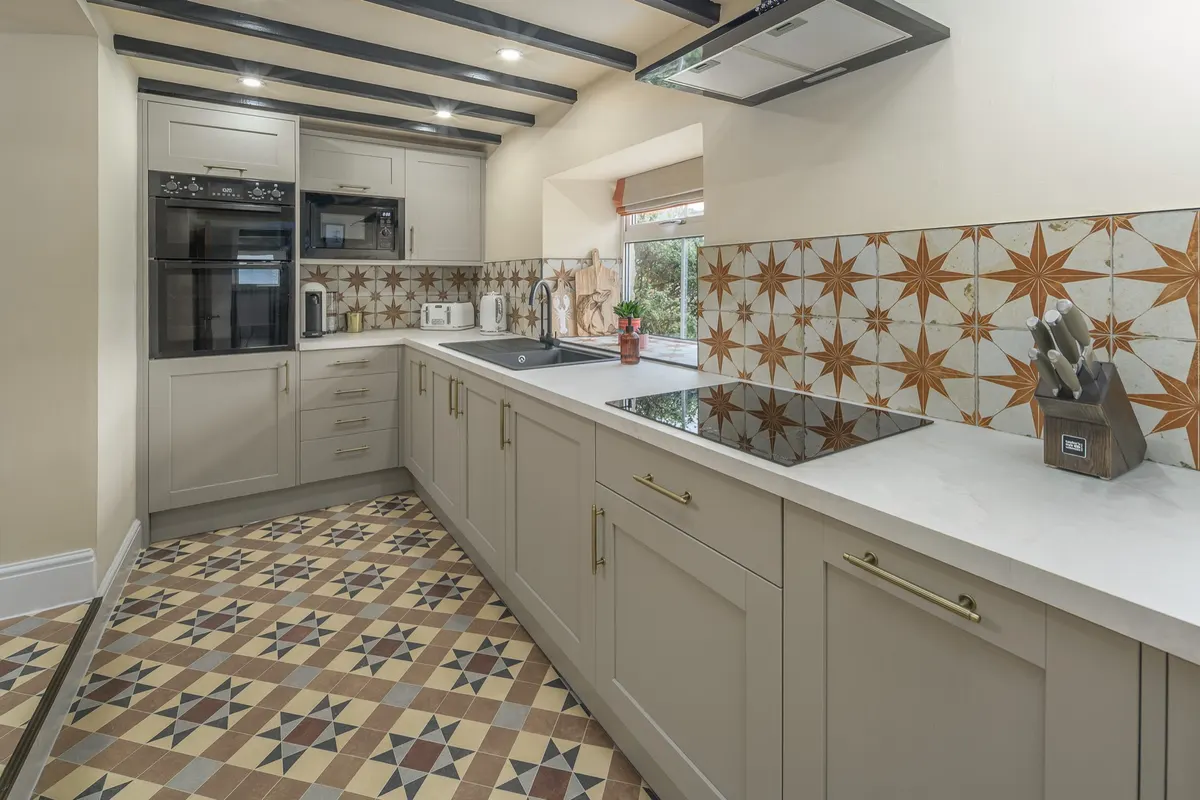 Kitchen with double oven and patterned tiles